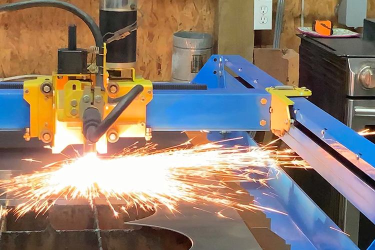 Metal being put on a CNC plasma cutter